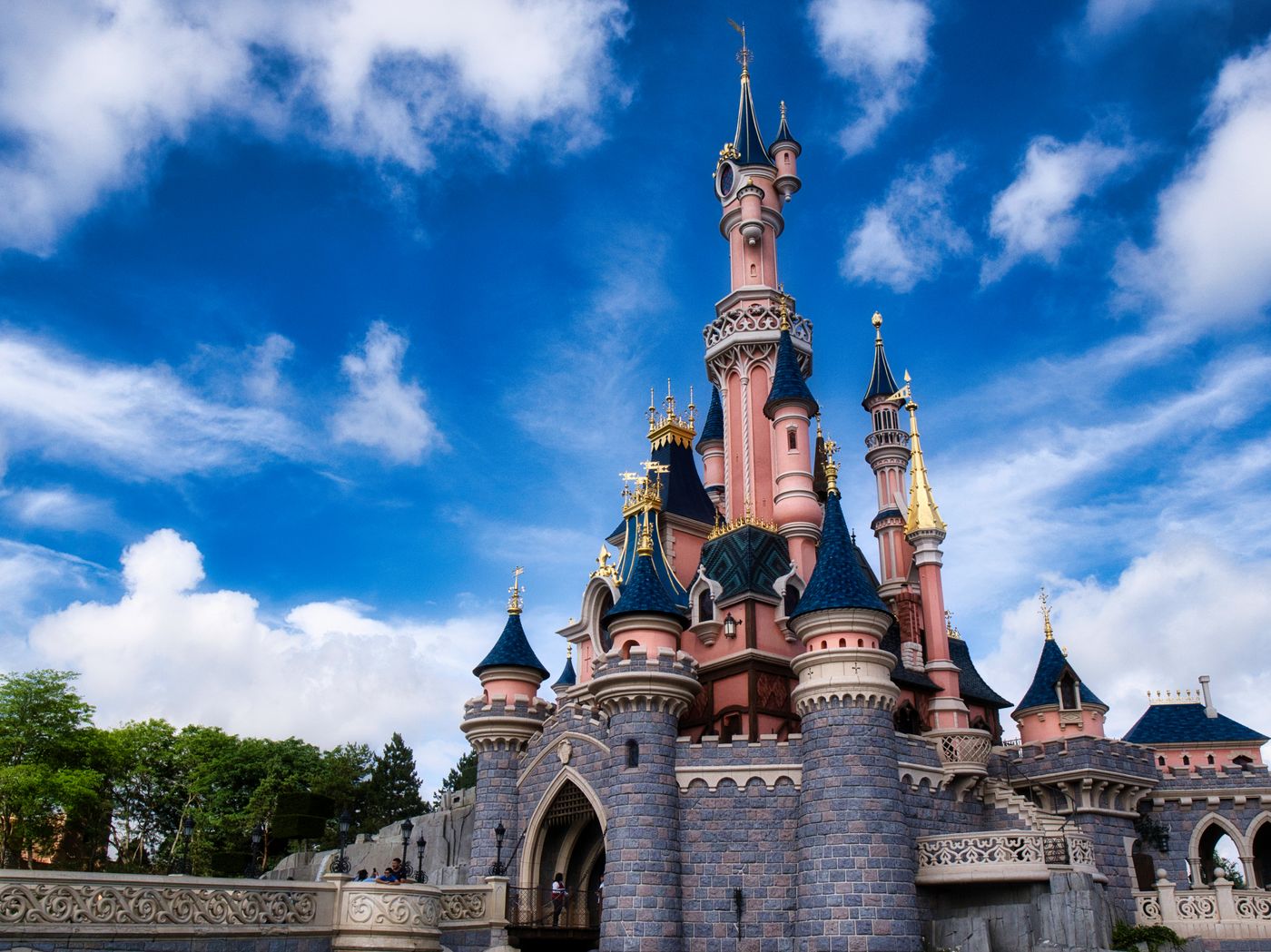 The castle at Disneyland Paris under a blue sky